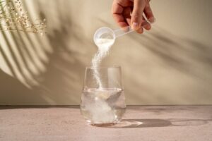 Collagen powder being added to water.